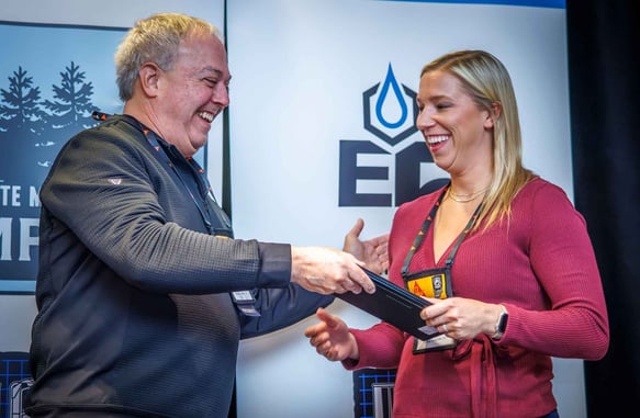 Kara Oppenhuis from Ozinga Ready Mix, Inc. receives her plaque recognizing her completion of the Developing Concrete Leaders Program with IRMCA.