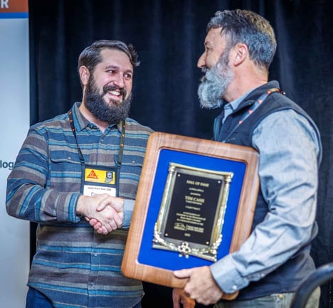 Tim Cash accepts the IRMCA Hall of Fame award from his colleague, Cameron Cash.